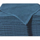 Stack of blue Microterry cotton auto towels with the top towel folded back to show the texture.
