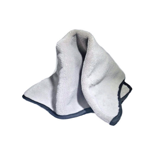 Light gray plush microfiber buffing towel draped to show its thick texture and dark bound edges on a white background